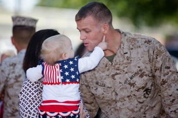 A Marine with II Marine Expeditionary Force Headquarters Group is reunited with his family, April 12, 2012 at Camp Lejeune, N.C.